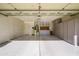 Spacious garage features ample storage cabinets, water heater, and a water softener system at 11250 E Kilarea Ave # 252, Mesa, AZ 85209