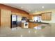 Kitchen featuring stainless steel appliances and breakfast bar at 11250 E Kilarea Ave # 252, Mesa, AZ 85209
