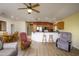 Comfortable living room with breakfast bar and open access to kitchen area at 11250 E Kilarea Ave # 252, Mesa, AZ 85209