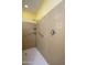 Accessible walk-in shower featuring grab bars, tiled walls, and a handheld shower head at 11250 E Kilarea Ave # 252, Mesa, AZ 85209