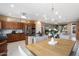 Bright dining room with modern chandelier and open floor plan at 19814 N Shadow Mountain Dr, Surprise, AZ 85374
