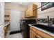 Clean laundry room with modern washer/dryer and ample counter space at 19814 N Shadow Mountain Dr, Surprise, AZ 85374