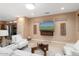 Bright living room with modern decor, a large television, and comfortable seating at 19814 N Shadow Mountain Dr, Surprise, AZ 85374