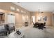 Expansive living room with comfortable seating and a poker table for entertaining at 19814 N Shadow Mountain Dr, Surprise, AZ 85374