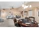 Spacious living room with plush seating, stylish decor, and a game table for entertaining at 19814 N Shadow Mountain Dr, Surprise, AZ 85374
