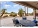 Covered patio with desert landscaping and a view of a golf course at 19814 N Shadow Mountain Dr, Surprise, AZ 85374