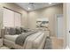 Bedroom featuring a large bed with comfortable pillows and a scenic wall decor at 26822 W Oraibi Dr, Buckeye, AZ 85396