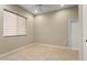 Bedroom with neutral walls, tile flooring, window with blinds, and ceiling fan at 26822 W Oraibi Dr, Buckeye, AZ 85396