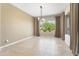 Bright dining area featuring a large window offering a view at 26822 W Oraibi Dr, Buckeye, AZ 85396