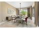 Dining room with modern chandelier, large window, and staged decor at 26822 W Oraibi Dr, Buckeye, AZ 85396