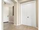 Welcoming foyer with tile flooring, a front door, and a coat closet for convenience at 26822 W Oraibi Dr, Buckeye, AZ 85396