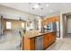 Modern kitchen with stainless steel appliances, granite counters, and a central island at 26822 W Oraibi Dr, Buckeye, AZ 85396