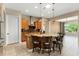 Spacious kitchen featuring a granite island with seating and pendant lighting at 26822 W Oraibi Dr, Buckeye, AZ 85396