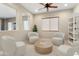 Modern living room featuring four chairs and a round table creating an inviting space at 26822 W Oraibi Dr, Buckeye, AZ 85396