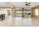Bright living area with large windows and sliding door access to outdoor patio at 26822 W Oraibi Dr, Buckeye, AZ 85396