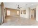 Spacious living area with neutral walls and tile floor bathed in natural light at 26822 W Oraibi Dr, Buckeye, AZ 85396