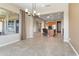 Open living space with tile floors that flows into the kitchen at 26822 W Oraibi Dr, Buckeye, AZ 85396