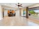 Spacious living area seamlessly connecting to a modern kitchen and outdoor access at 26822 W Oraibi Dr, Buckeye, AZ 85396