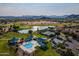Aerial view of community pool, tennis courts, and golf course at 298 E Diamond Trl, San Tan Valley, AZ 85143