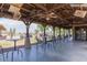 Relaxing patio with tables and chairs, overlooking golf course at 298 E Diamond Trl, San Tan Valley, AZ 85143