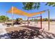 Community playground with shaded swings and play structures at 298 E Diamond Trl, San Tan Valley, AZ 85143