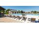Community pool with lounge chairs and patio furniture at 298 E Diamond Trl, San Tan Valley, AZ 85143