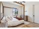 Spacious bedroom with a wooden canopy bed and plenty of light at 4424 N 38Th St, Phoenix, AZ 85018