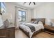Light and airy bedroom with wood floors and a queen bed at 4424 N 38Th St, Phoenix, AZ 85018