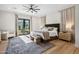 Bright bedroom with king-size bed, plush rug, and access to a private balcony at 4424 N 38Th St, Phoenix, AZ 85018