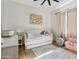 Well-lit bedroom featuring a daybed and soft pink accents at 4424 N 38Th St, Phoenix, AZ 85018
