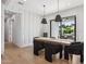 Bright dining room with modern light fixtures and hardwood floors at 4424 N 38Th St, Phoenix, AZ 85018