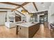 Open concept kitchen with large island, views into living room, and hardwood floors at 4424 N 38Th St, Phoenix, AZ 85018
