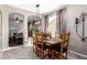 Dining room with wooden table and chairs, and view to living room at 8813 N 112Th Ave, Peoria, AZ 85345