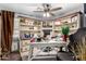 Home office features built-in corner shelving and a large desk at 8813 N 112Th Ave, Peoria, AZ 85345