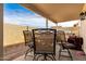 Covered patio with seating area, grill, and small yard at 8813 N 112Th Ave, Peoria, AZ 85345