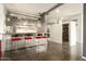 Stylish bar area with stainless steel counters, seating for four, and wine fridge at 914 E Osborn Rd # 202, Phoenix, AZ 85014