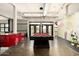 Spacious game room featuring a stylish pool table, a mural, and concrete flooring at 914 E Osborn Rd # 202, Phoenix, AZ 85014