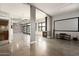 Open living room features a fireplace, brick wall and large windows allowing plenty of natural light at 914 E Osborn Rd # 202, Phoenix, AZ 85014