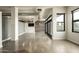 Open living space with brick accent wall, TV and many windows to the outside at 914 E Osborn Rd # 202, Phoenix, AZ 85014
