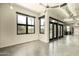Bright living room with large windows offering natural light and ceiling fan at 914 E Osborn Rd # 202, Phoenix, AZ 85014