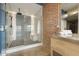 Modern walk-in shower with tiled walls, matte black hardware, and a built in bench at 914 E Osborn Rd # 202, Phoenix, AZ 85014