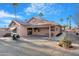 Back of home shows patio with outdoor furniture and gas grill at 10309 E Twilight Ct, Sun Lakes, AZ 85248