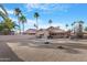 Backyard features a patio and a water feature, complemented by desert landscaping at 10309 E Twilight Ct, Sun Lakes, AZ 85248