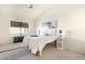 Bright bedroom features a ceiling fan and a patterned rug at 10309 E Twilight Ct, Sun Lakes, AZ 85248