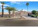 Charming single-story home featuring desert landscaping, palm trees, and a two-car garage at 10309 E Twilight Ct, Sun Lakes, AZ 85248