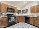 Kitchen featuring tile flooring, stainless steel appliances and granite countertops at 10309 E Twilight Ct, Sun Lakes, AZ 85248