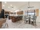 Open kitchen with granite countertops, a breakfast bar, and stainless steel appliances at 10309 E Twilight Ct, Sun Lakes, AZ 85248