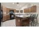 The home features a kitchen with stainless steel appliances and granite countertops at 10309 E Twilight Ct, Sun Lakes, AZ 85248