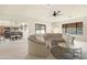 Inviting living room with an open layout, plush seating, and access to the kitchen area at 10309 E Twilight Ct, Sun Lakes, AZ 85248