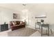 Comfortable office space with a brown leather sofa and a functional desk setup at 10309 E Twilight Ct, Sun Lakes, AZ 85248